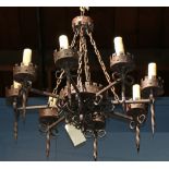 Spanish Revival wrought iron chandelier, having eight lights with Medieval style supports, 31"h