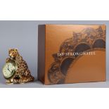 Jay Strongwater " Walter" leopard holding a clock, part of the Jungle series, executed in amber,