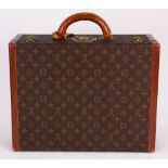 Louis Vuitton Paris Coteville hard shell suitcase, with the classic brown and gold "LV" monogram