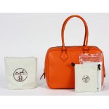 Hermes plume handbag, executed in orange, 28cm, retains dust bag, rain jacket, and original box,