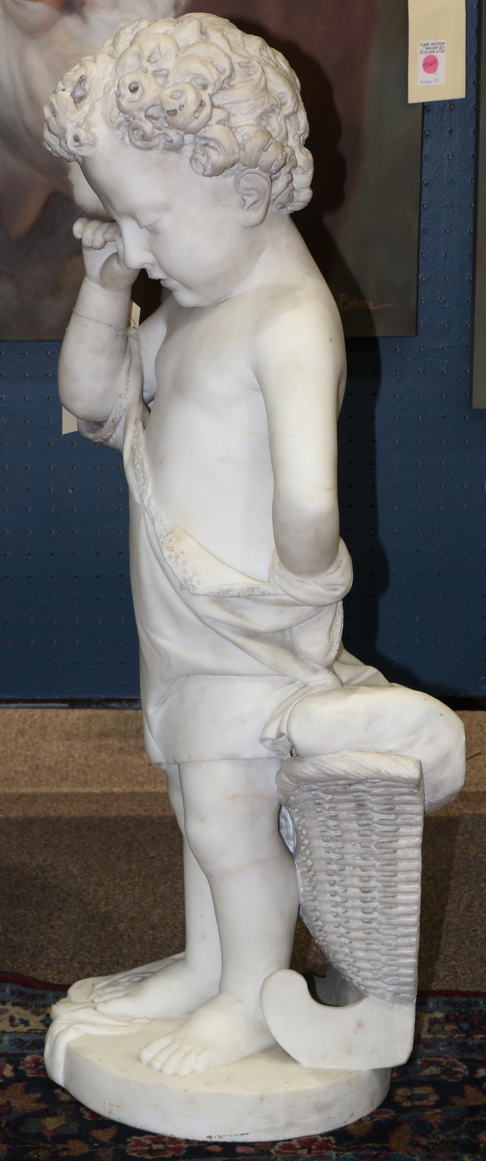 Continental marble figural sculpture, depicting a young boy, with curly hair, rubbing his eye in a - Image 2 of 3