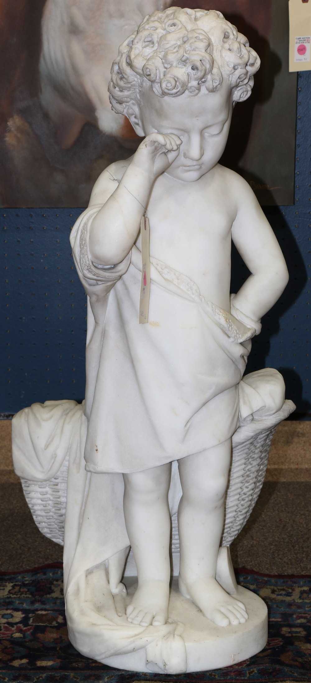 Continental marble figural sculpture, depicting a young boy, with curly hair, rubbing his eye in a
