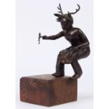 Patinated bronze Kachina figure, rising on a wood base, 9.5"h x 5"w x 6.5"d