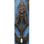 (lot of 2) Papua New Guinea wood carving group, the polychrome one in the style of a house mask with