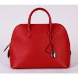 Hermes bolide swift web handbag, executed in red, 31cm, with rain jacket, lock, clochette, and
