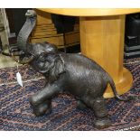 Patinated bronze figural sculpture depicting an elephant, 30"h