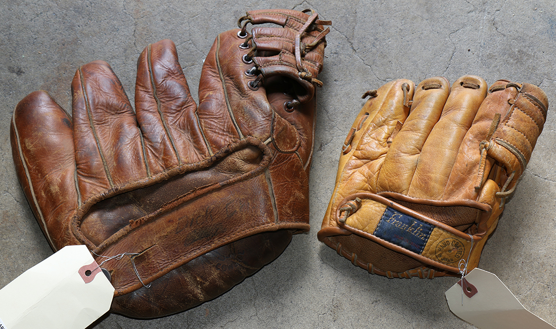 (lot of 2) Vintage leather baseball gloves, consisting of a 1940's leather five finger baseball