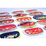 (lot of 15) Chinese embroidered silk wallets, most of oval form satin stitched with flowers and