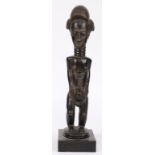 Baule Cote d'Ivorie standing male figure, finely and sensitively carved of blackened wood, with a