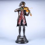Patinated and paint decorated figural sculpture, depicting a young prodigy playing the violin, and