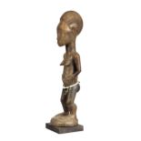 Baule Cote d'Ivorie standing female figure, finely and sensitively carved standing female figure,