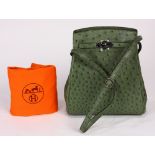 Hermes Paris Kelly Sport olive ostrich cross body handbag, with dustbag, rain jacket, box, and