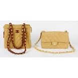 (lot of 2) Chanel resin lambskin handbags, each having a quilted pattern, one having a flap, the