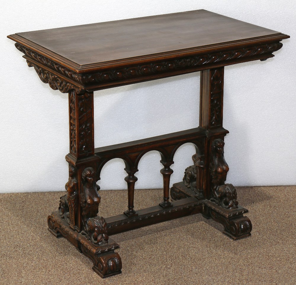 Renaissance Revival carved stand, the three tiered stand having adjustable shelves, the supports