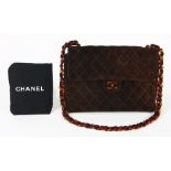 Chanel maxi single suede handbag, executed in brown with a quilted pattern, having tortoise shell