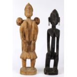 (lot of 2) West African figural group, including one depicting a male with a back satchel, H: 20 3/4
