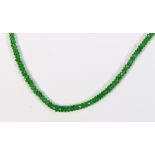 Tsavorite garnet bead and 18k yellow gold necklace Featuring numerous faceted tsavorite garnets,