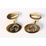 Pair of 18k yellow gold horse cufflinks Featuring (1) oval disc, measuring approximately 20 X 12 mm,