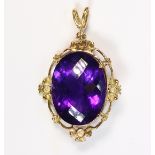 Amethyst and 14k yellow gold pendant Centering (1) faceted-top oval-cut amethyst, measuring