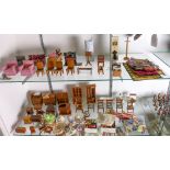 Two shelves of vintage doll house furniture and accessories, including a sofa, armchairs, slant-