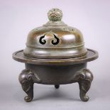 Chinese lidded bronze censer, the circular body with a flared rim raised on three zoomorphic