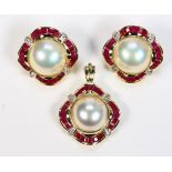 Mabe pearl, ruby, diamond and 14k yellow gold pendant Including 1) pair of 13.0 mm, mabe pearl,