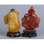 (lot of 2) Chinese stone snuff bottles: the first of carnelian, with a flattened body flanked by a