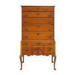 Chippendale style highboy, executed in pine circa 1860, having six graduated drawers above the lower