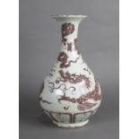 Chinese underglazed red porcelain vase, the yuhuchunping of a meandering four-claw dragon amid