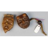(lot of 2) Japanese wooden mask netsuke, 19th century, in the form of a man with goatee; the other
