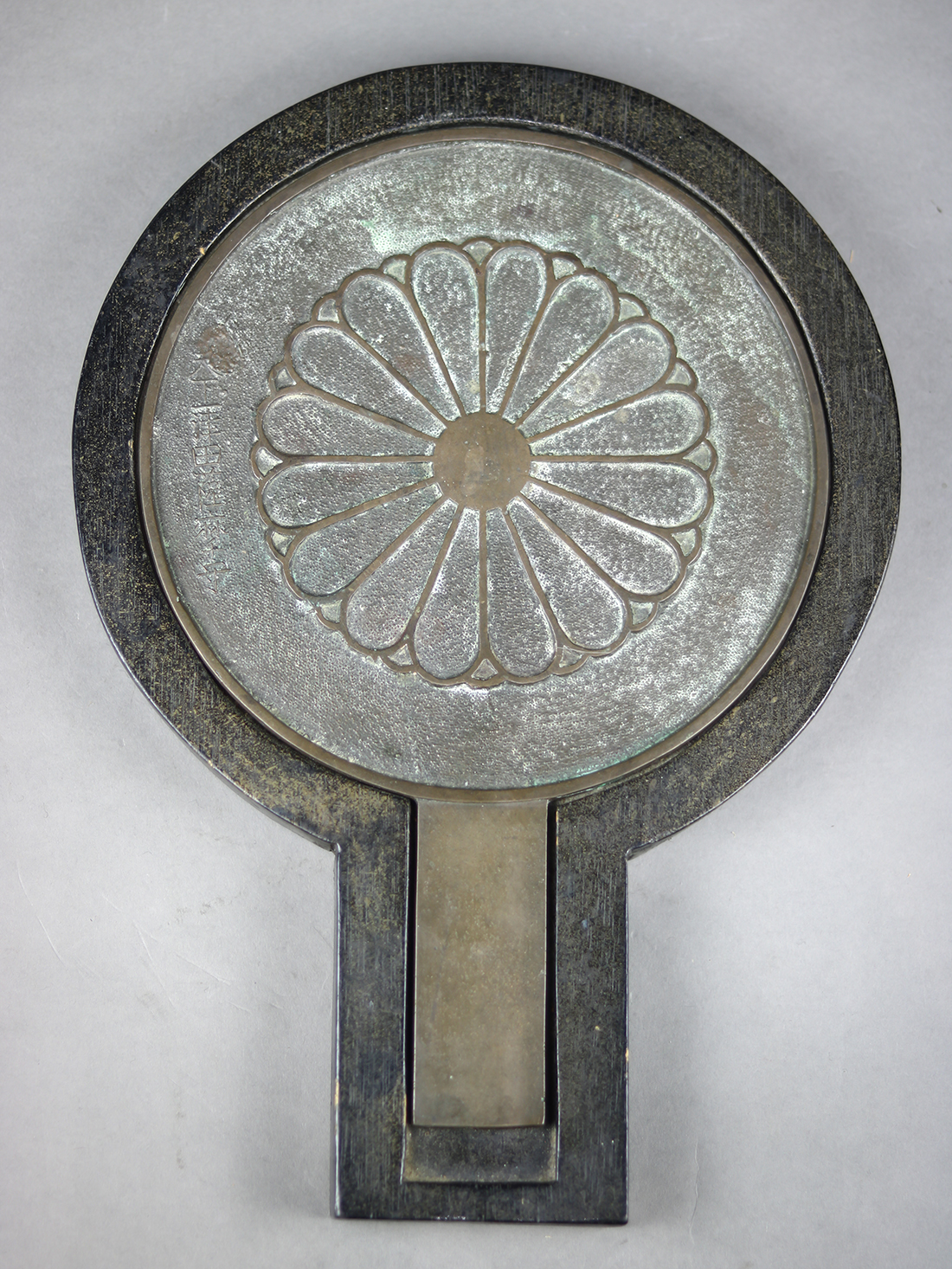 Japanese bronze mirror with wooden case, with a molded imperial 16-petal chrysanthemum crest,
