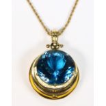 Blue topaz, 18k yellow gold and gold-filled pendant-necklace Featuring (1) round-cut blue topaz