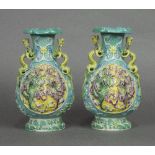 Pair of Chinese porcelain vases, with a foliate rim and neck flanked by yellow dragon handles, the