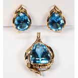 Blue topaz, diamond and 14k yellow gold jewelry suite Including 1) pendant, featuring (1)