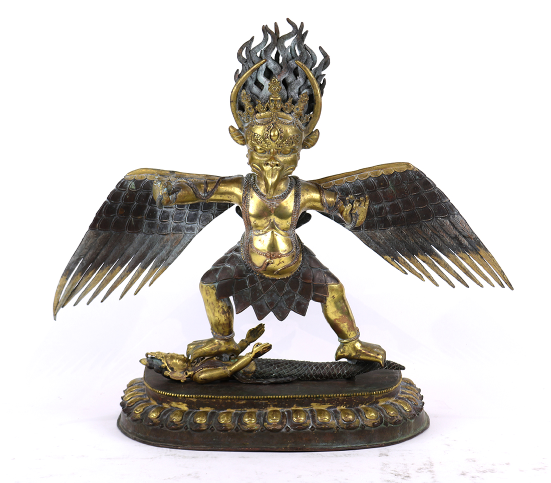 Himalayan copper alloy sculpture of Garuda, standing above a mermaid on a separate lotus pedestal (