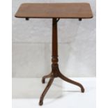 Federal mahogany tilt top table, having a rectangular top, above a turned standard, and rising on