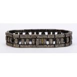 Diamond, blackened and gilted silver bracelet Featuring approximately (930) round-cut diamonds,