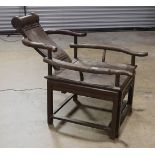 Chinese reclining chair, with a rolling neck rest to the reclined back, the rectangular seat fronted