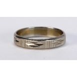 Yellow gold and platinum band The platinum and yellow gold textured band, measures approximately 3.4