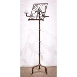 French hand wrought iron music stand circa 1860, having two swing arm candle holders flanking the