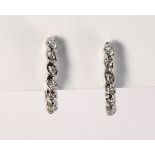 Pair of diamond and 14k white gold earrings Featuring (14) full-cut diamonds, weighing a total of