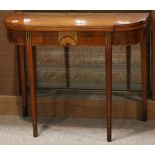 Federal mahogany games table, having an inlaid hinged top, and rising on tapered legs, 29"h x 35.5"w