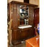 Victorian hall tree, the caned top over the centered beveled mirror plate, flanked on either side by