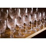 Four shelves of Continental cut glass stemware, consisting of (16) water goblets, (17)