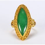 Jadeite and 24k yellow gold ring Centering (1) navette-shaped jadeite cabochon, measuring
