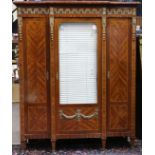 French Neoclassical style marquetry decorated vitrine, with brass mounts, having a shaped top, above