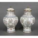 Pair of Chinese painted enameled metal urns, the body decorated with roundel roundels in pastel hues