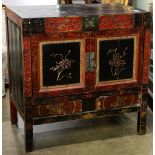 Chinese red and black lacquered cabinet, pair of hinged double doors carved with bird and flowers,