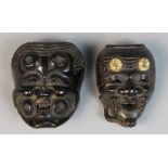 (lot of 2) Japanese wooden mask netsuke, 19th century: two carved masks of Okina, one with gilt