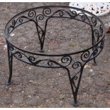 Wrought iron low table, painted black 15"h x 25.5"dia.